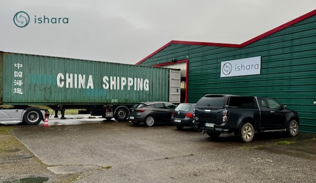 a 40" container is being loaded with used copiers before shipping to China